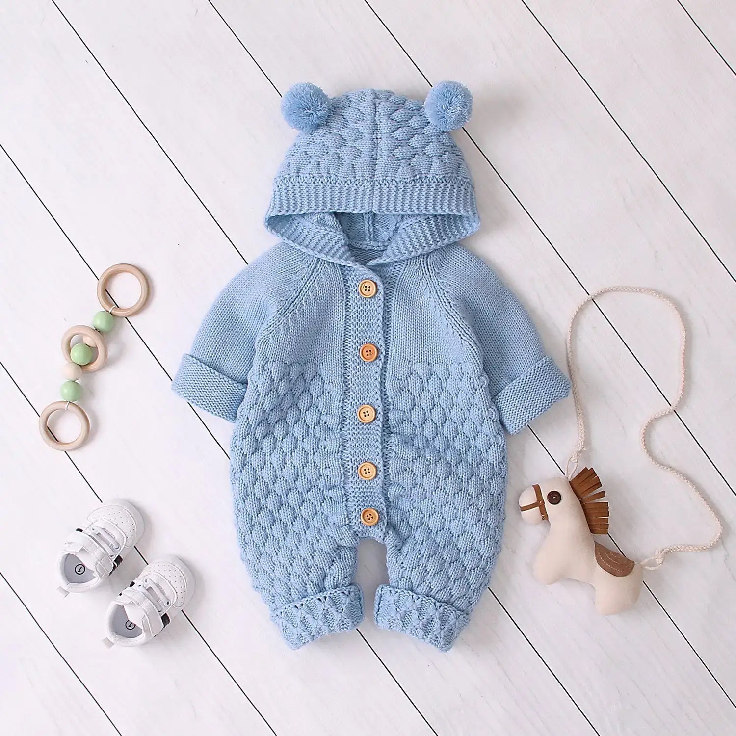 Ear Knit Romper With Hoodie Wrap Your Little One in Cozy Comfort with Our Ear Knit Romper HoodieImagine your baby wrapped in the softest knit fabric, snuggled up in a romper with an adorable hoodie. This piece is perfect for chilly days, ensuring your chi