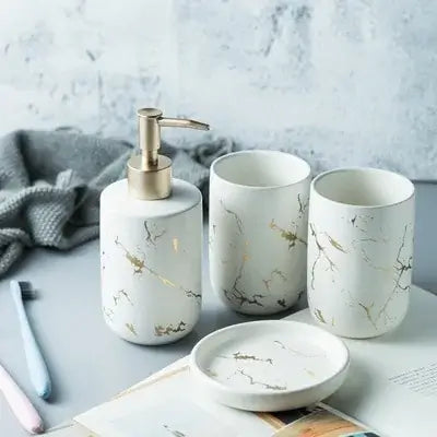 Nordic Matte Bathroom Accessories Set Elevate your bathroom into a sanctuary of opulence with our Nordic Matte Gold Ceramics Bathroom Accessories Set. Imbued with a touch of Scandinavian charm, this exquisite ensemble exudes sophistication while seamlessl