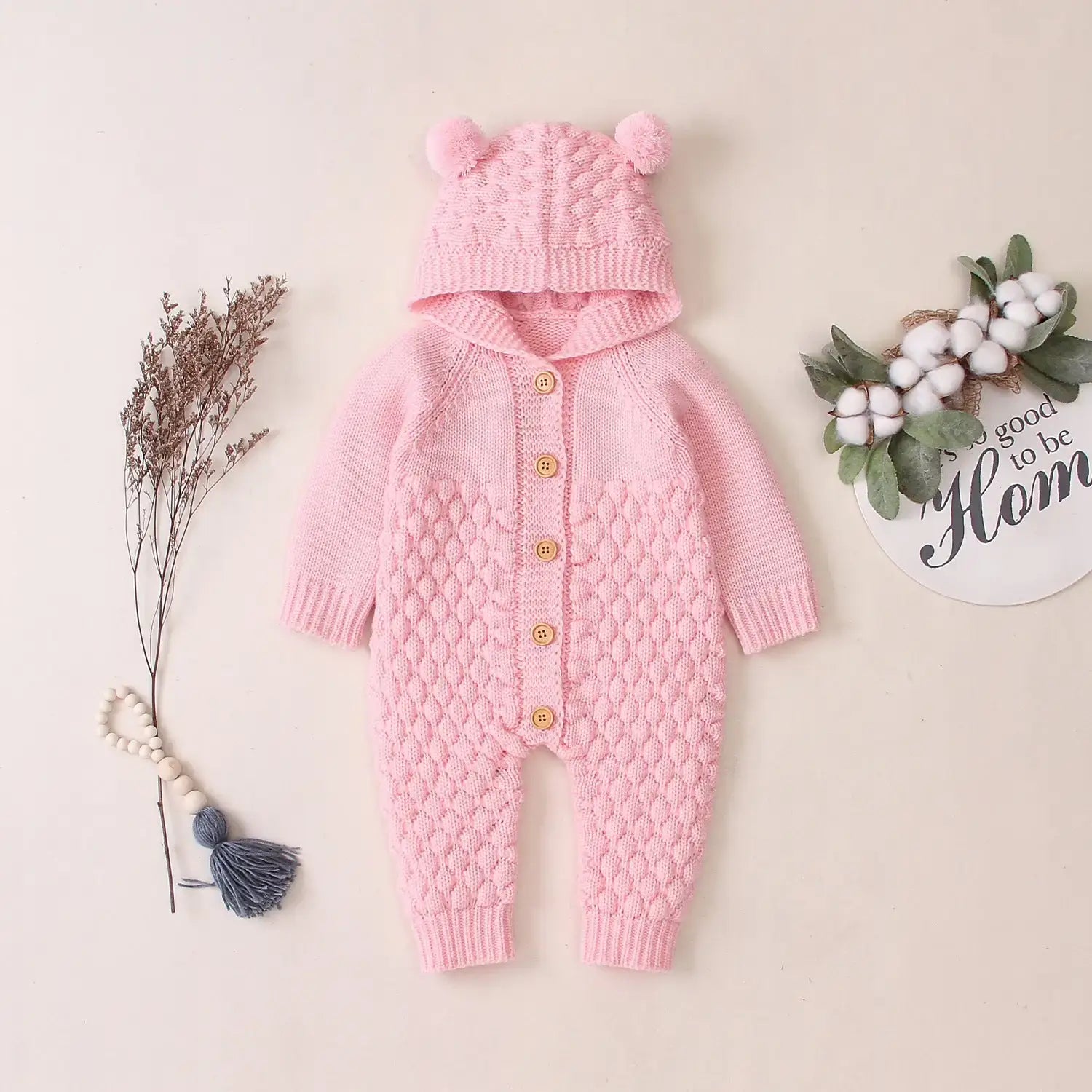 Ear Knit Romper With Hoodie Wrap Your Little One in Cozy Comfort with Our Ear Knit Romper HoodieImagine your baby wrapped in the softest knit fabric, snuggled up in a romper with an adorable hoodie. This piece is perfect for chilly days, ensuring your chi