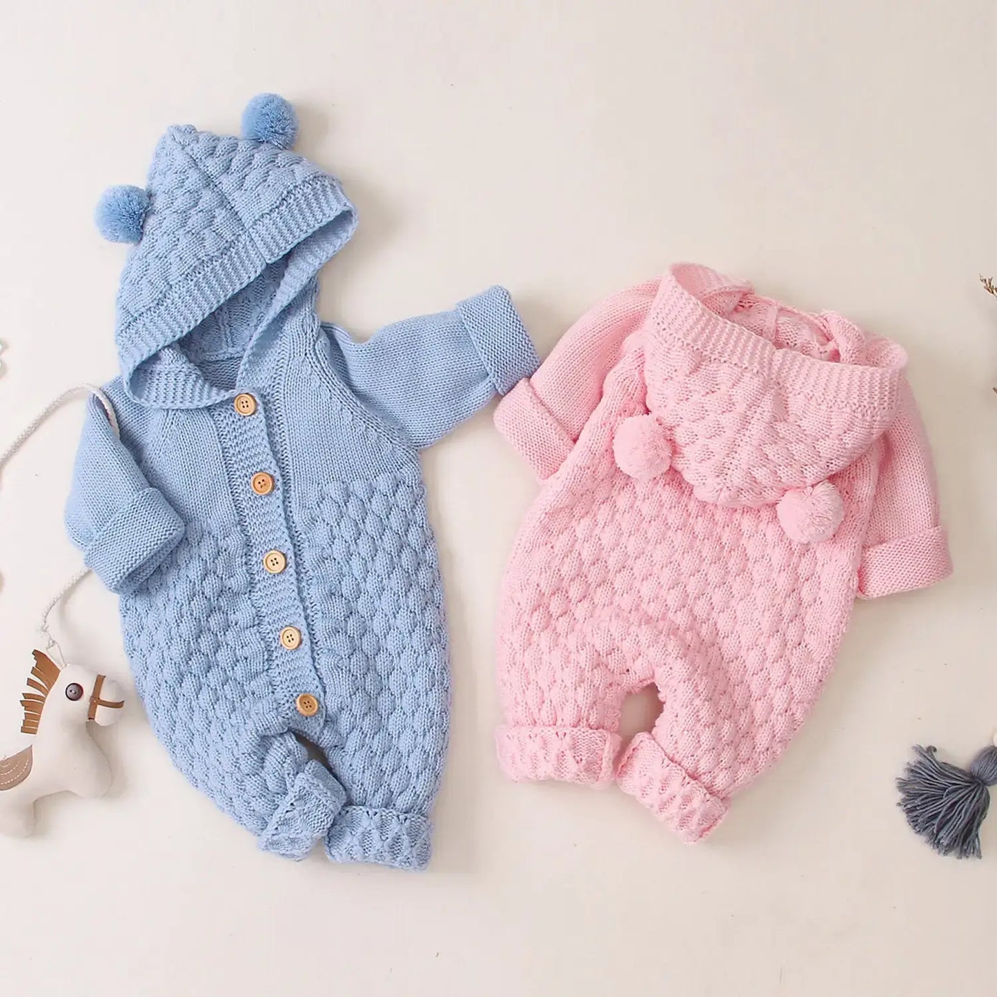 Ear Knit Romper With Hoodie Wrap Your Little One in Cozy Comfort with Our Ear Knit Romper HoodieImagine your baby wrapped in the softest knit fabric, snuggled up in a romper with an adorable hoodie. This piece is perfect for chilly days, ensuring your chi